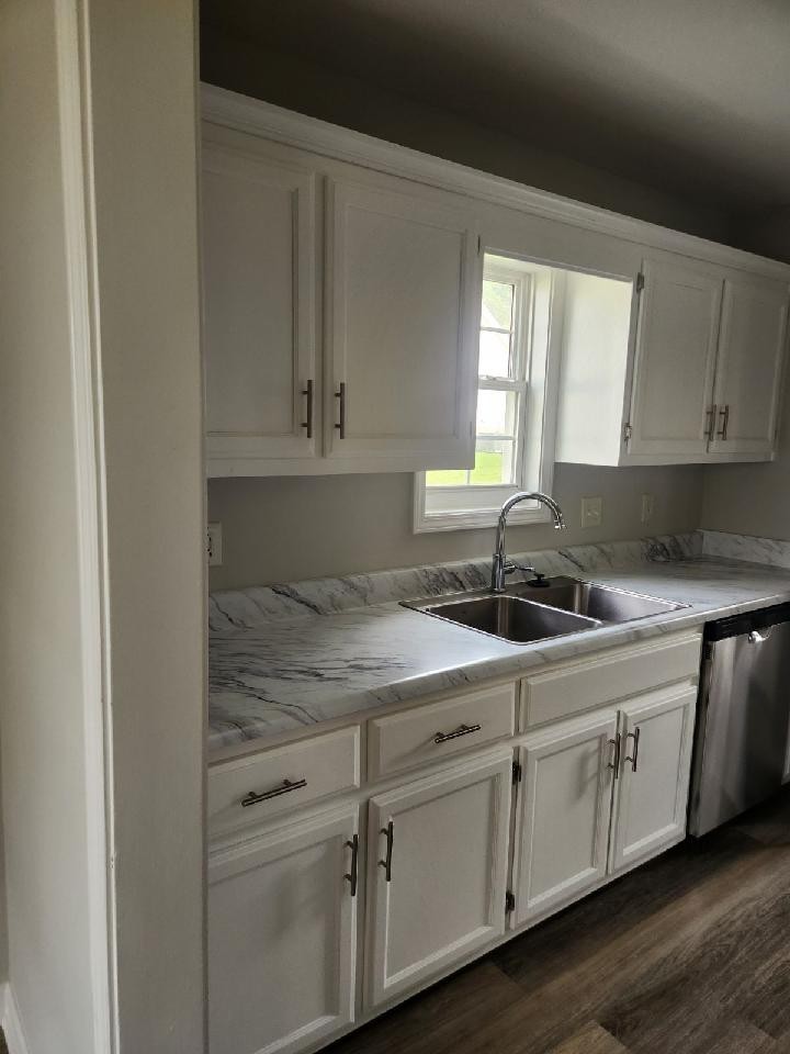 318 Reeves Court Springfield, TN 37172 - Photo 6 of 9 a kitchen with white cabinets appliances a sink and a window