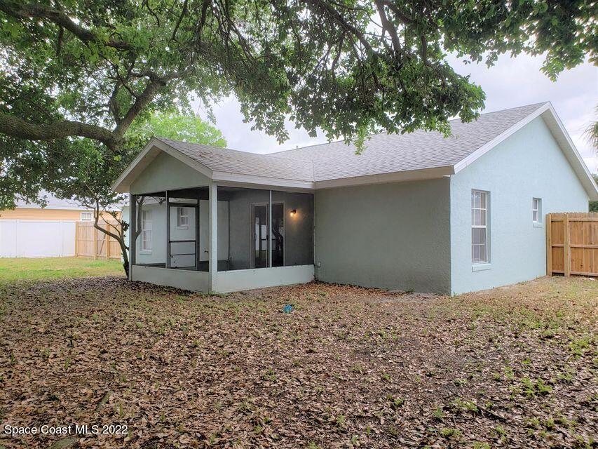 5649 Beaverbrook Street Cocoa, FL 32927 - Photo 25 of 29 a front view of a house with a garden