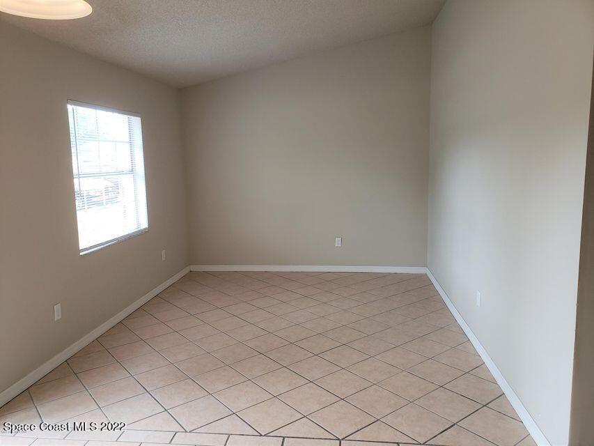 5649 Beaverbrook Street Cocoa, FL 32927 - Photo 4 of 29 an empty room with a window