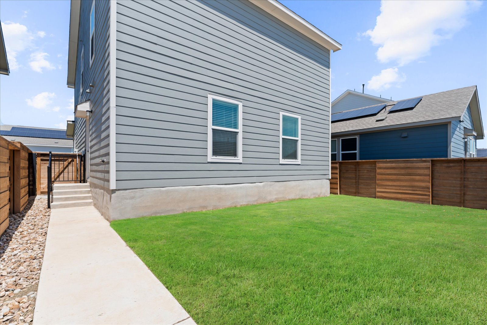 905 Powell Kyle, TX 78640 - Photo 34 of 37 a front view of a house with a yard