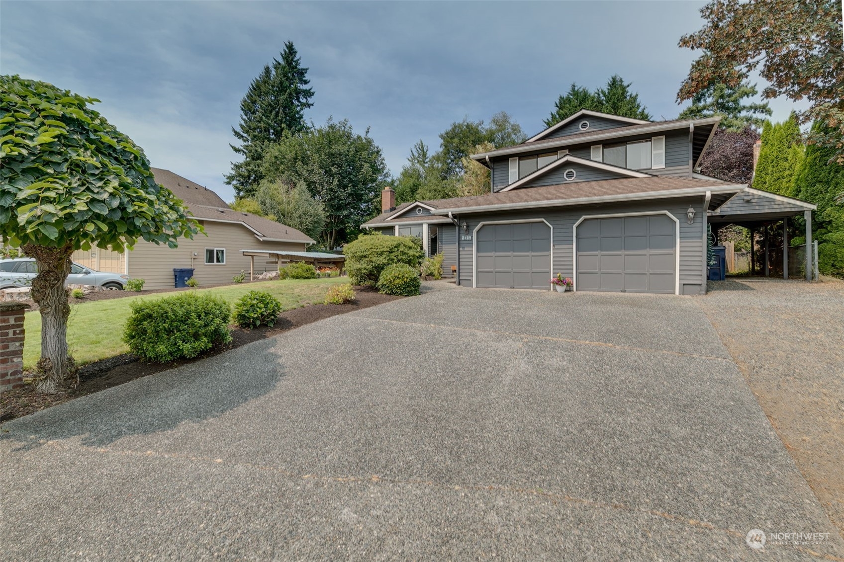 2409 169th Place Southeast Bothell, WA 98012 - Photo 3 of 37 a view of a house with a yard and potted plants