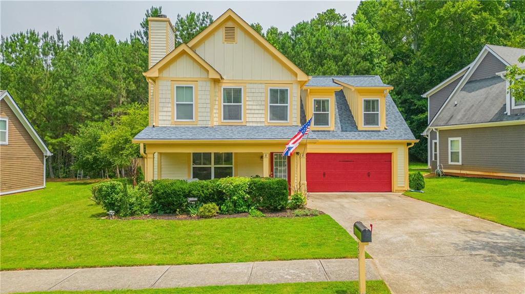 Undisclosed Address Athens, GA 30606 - Photo 1 of 1 a front view of a house with a yard and garage