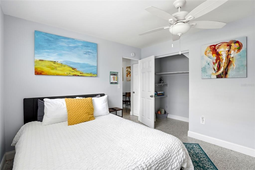 2311 Bay Boulevard Indian Rocks Beach, FL 33785 - Photo 38 of 80 a bedroom with a bed and painting on the wall