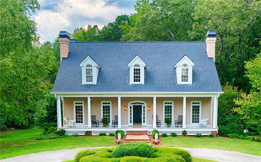 12700 Bethany Road Alpharetta, GA 30004 - Photo 1 of 1 Welcome Home! Historic reproduction home, The Brier Patch, sits on 2 private acres in desirable Alpharetta, walking distance to Crabapple ES, Northwestern MS and Milton HS. 6 white columns, 3 dormers and chimneys greet you as you walk up the brick walkway to the 8ftx48ft rocking chair front porch. The acre long driveway takes you to round-a-bout for easy ingress/egress and also down to your 3 car garage with large parking area for a basketball goal, projects and ample parking for all your house guests.