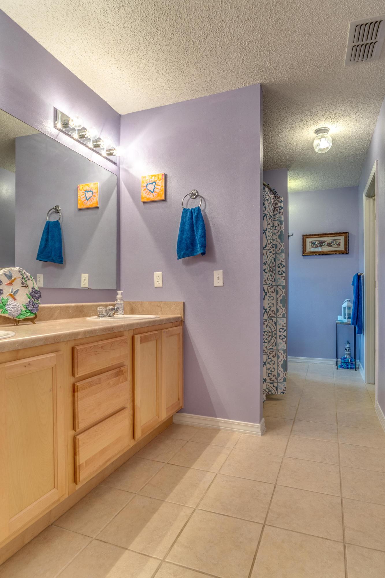 272 Limestone Circle Crestview, FL 32539 - Photo 21 of 30 a bathroom with a sink and a mirror