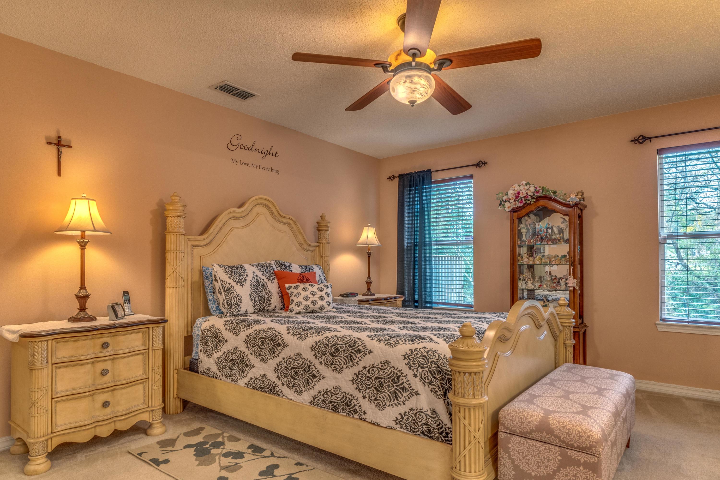272 Limestone Circle Crestview, FL 32539 - Photo 24 of 30 a bedroom with a bed and a chandelier