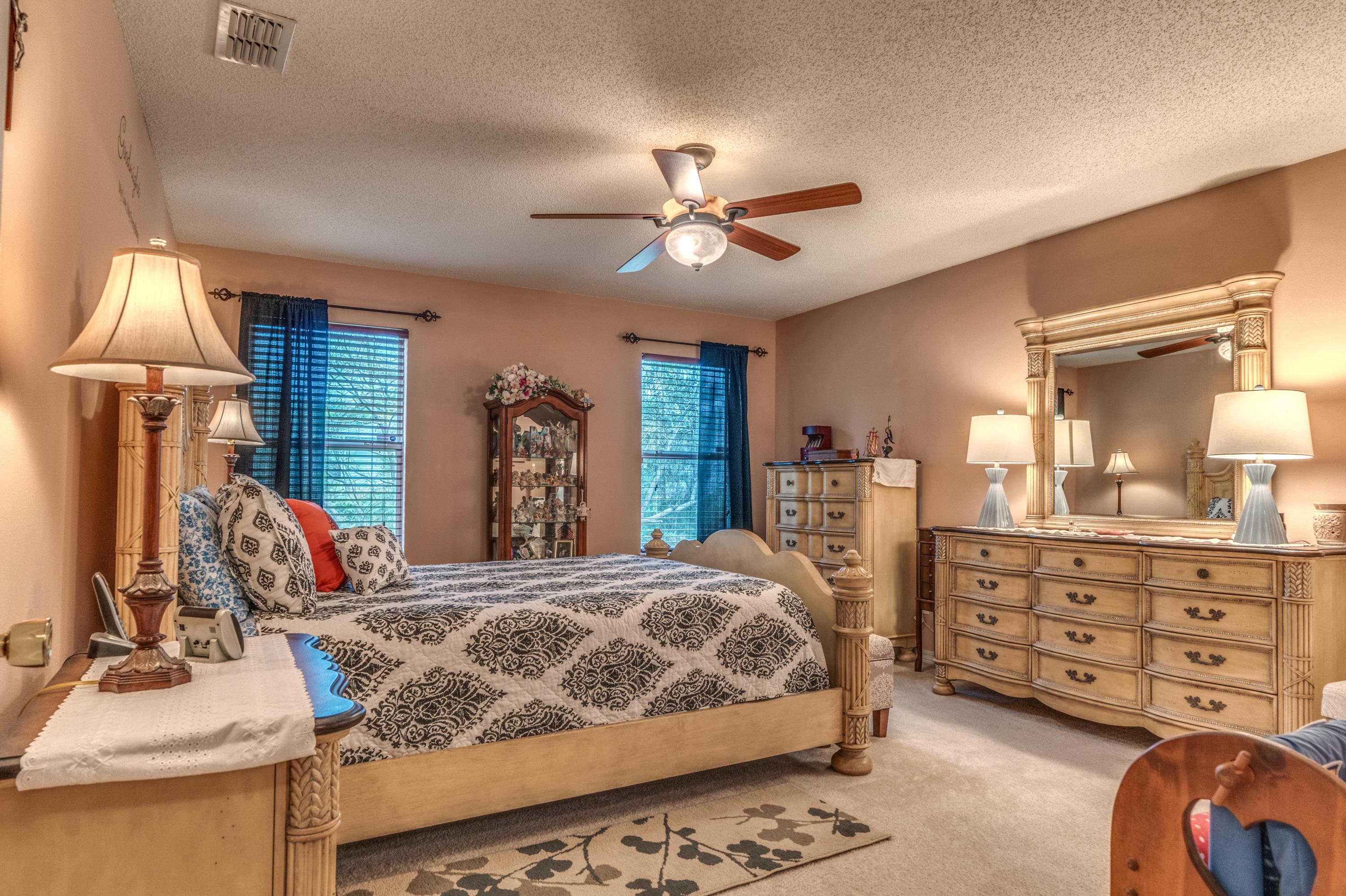 272 Limestone Circle Crestview, FL 32539 - Photo 25 of 30 a bedroom with a bed and a dresser