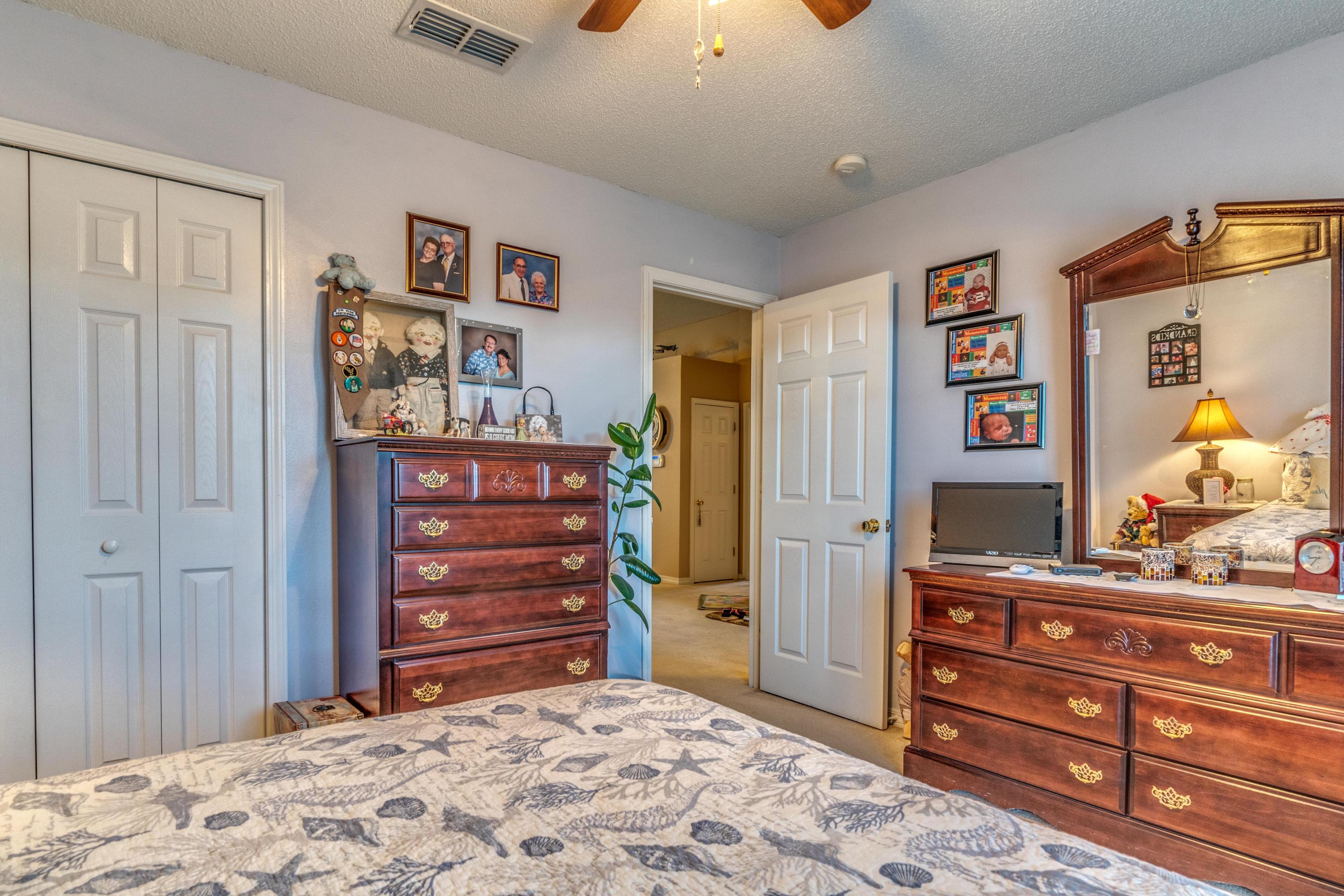 272 Limestone Circle Crestview, FL 32539 - Photo 28 of 30 a bedroom with a bed and a dresser in it