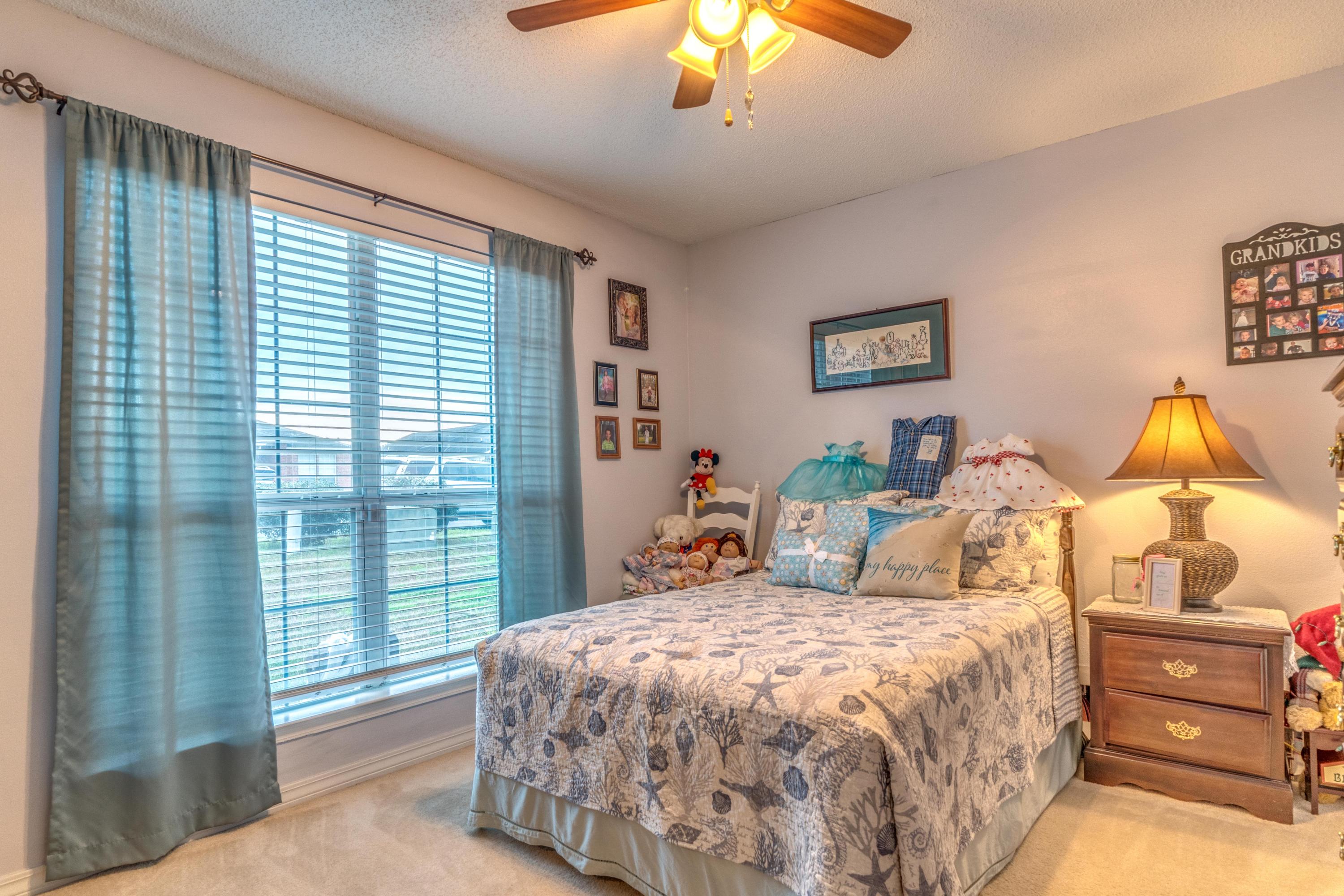 272 Limestone Circle Crestview, FL 32539 - Photo 29 of 30 a bedroom with a bed and a window