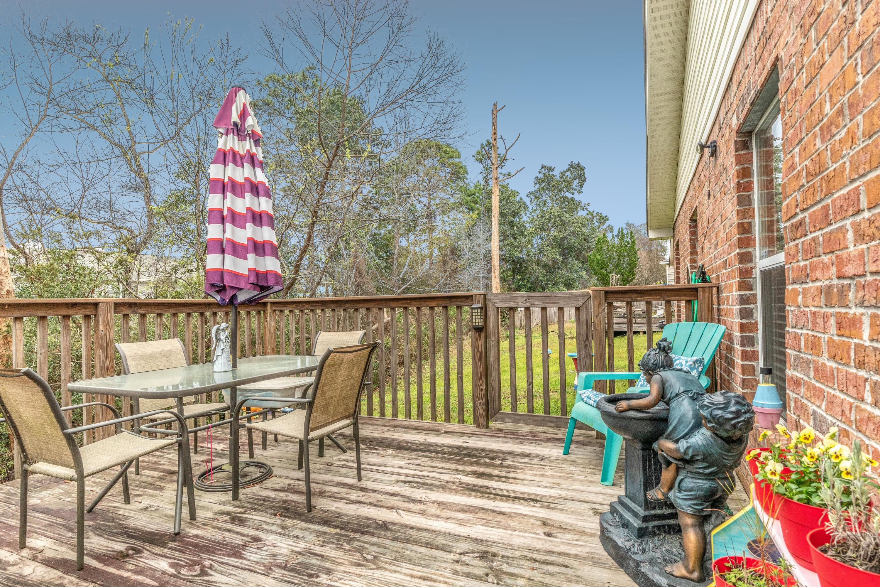 272 Limestone Circle Crestview, FL 32539 - Photo 4 of 30 a view of a chairs and table in patio