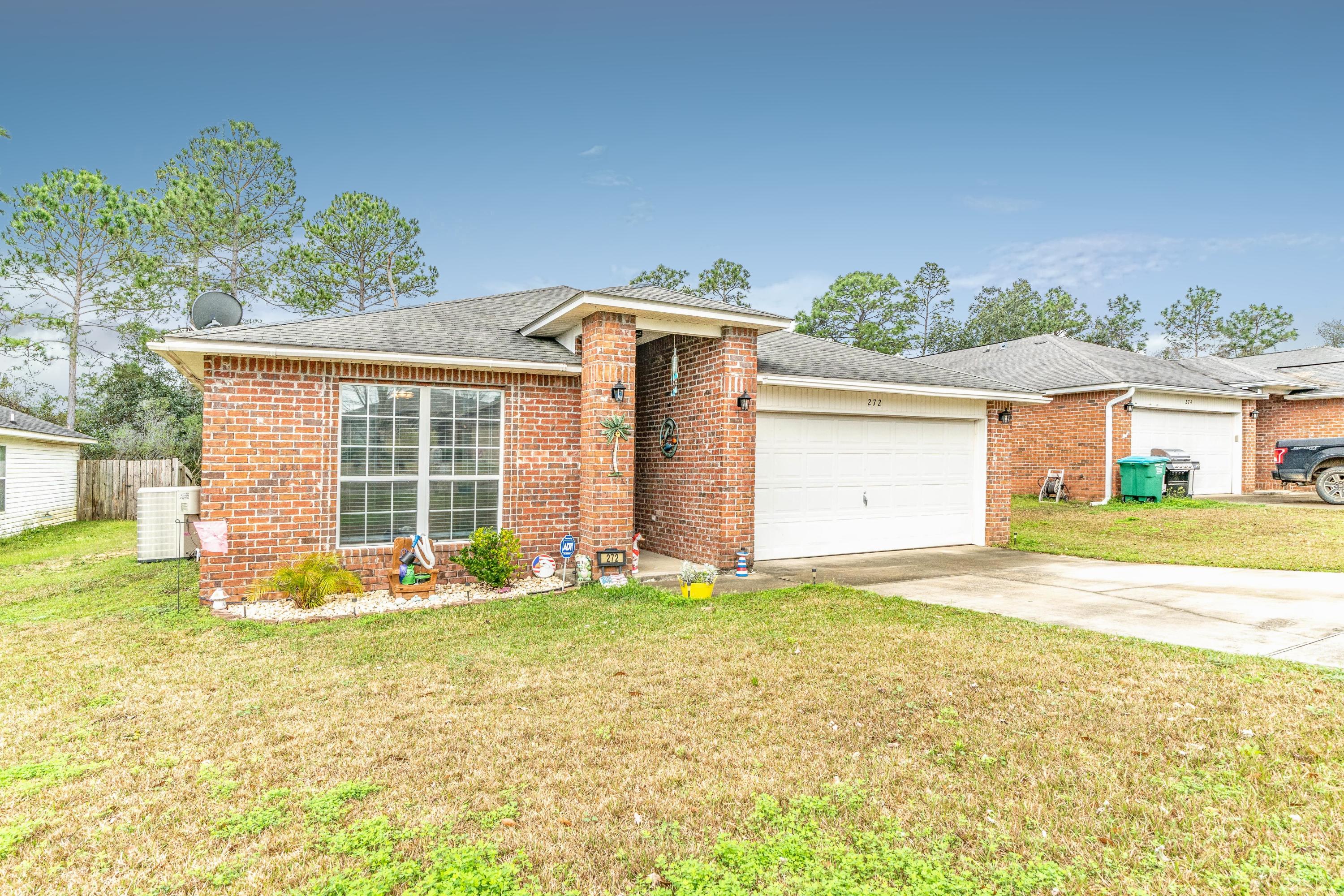 272 Limestone Circle Crestview, FL 32539 - Photo 7 of 30 a front view of a house with a yard