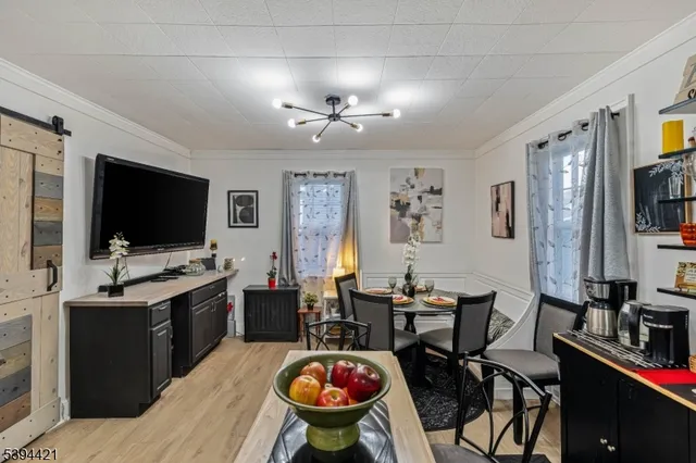 a view of a livingroom with furniture and a flat screen tv