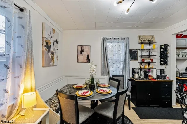 a view of a dining room with furniture and window