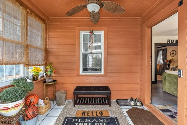 a front view of a house with outdoor seating