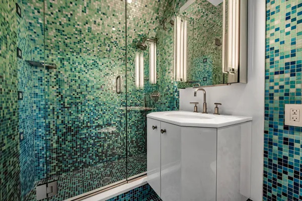 a bathroom with a sink and mirror