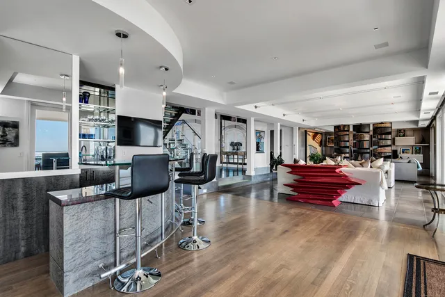 a kitchen with furniture and a fireplace