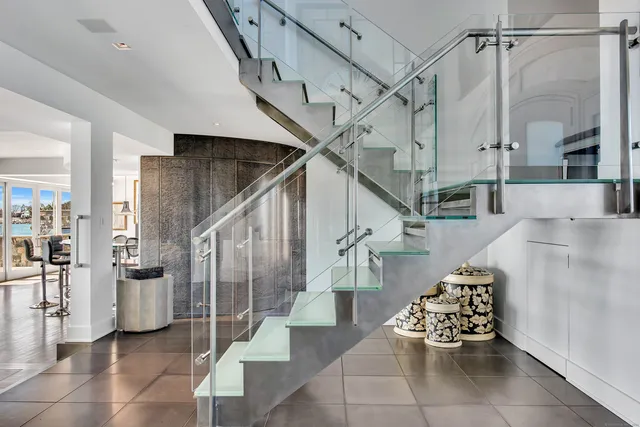 a large bed sitting in a bedroom next to a window