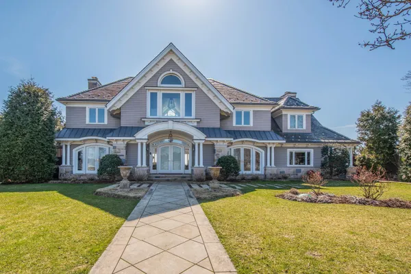 a front view of a house with swimming pool