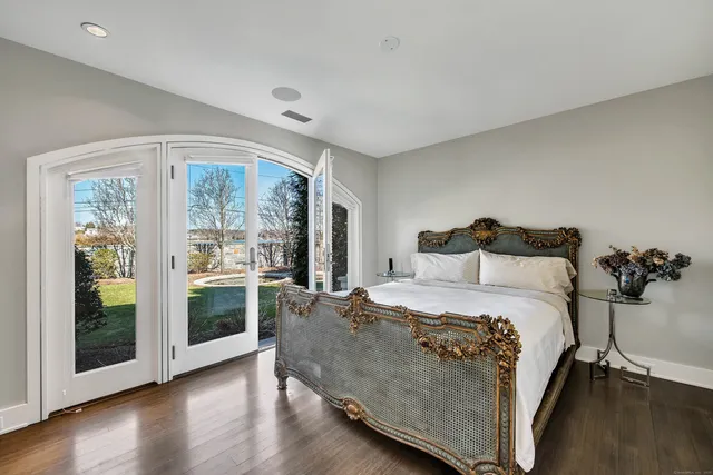 a bathroom with a sink vanity granite shower and a mirror