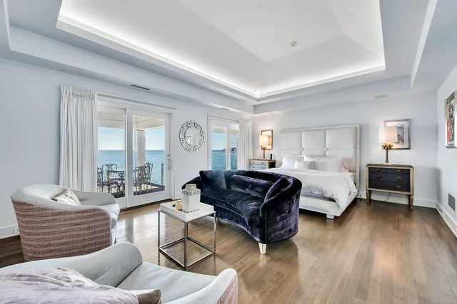 a bathroom with a tub a double vanity sink a mirror and a shower