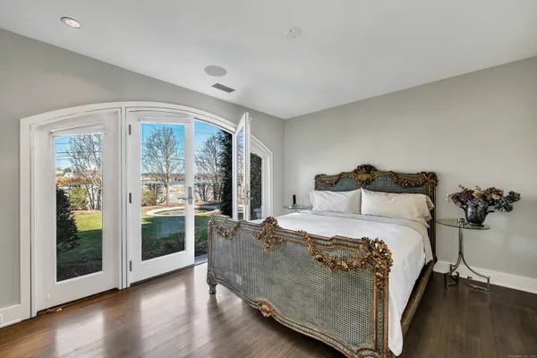 a bathroom with a sink vanity granite shower and a mirror