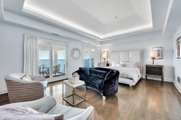 a bathroom with a tub a double vanity sink a mirror and a shower