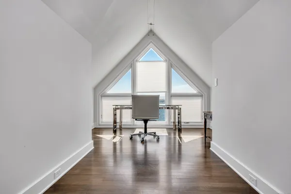a view of a patio with a table and chairs