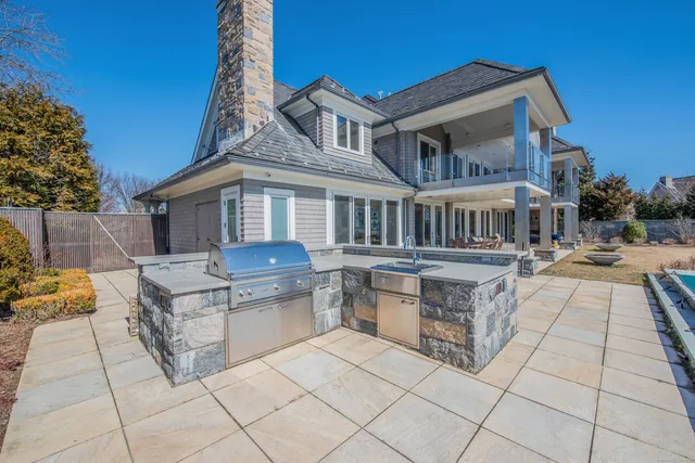 a front view of a residential apartment building with a yard