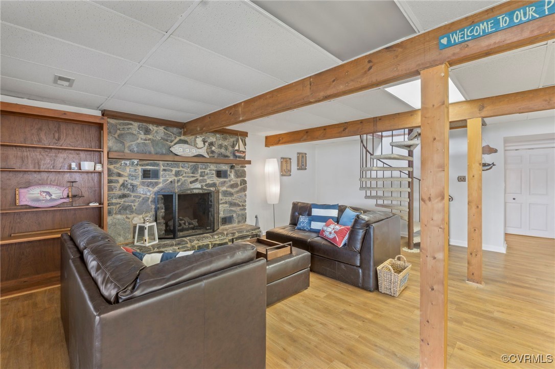 104 Manassas Point Locust Grove, VA 22508 - Photo 28 of 47 a living room with furniture a fireplace and a wooden floor