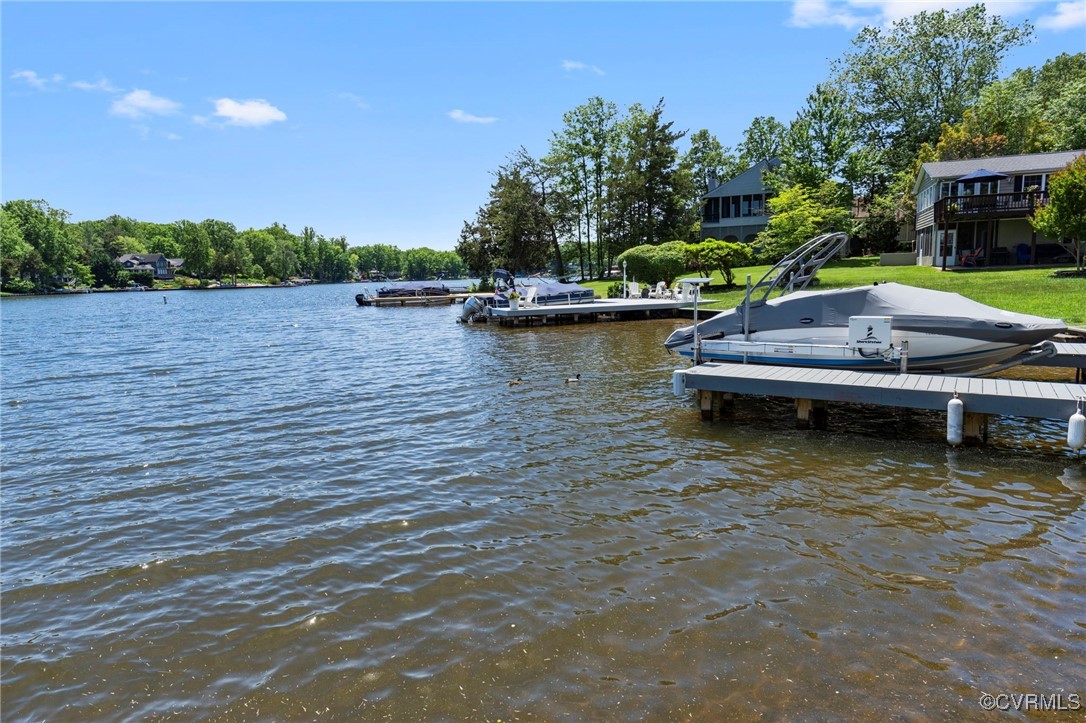 104 Manassas Point Locust Grove, VA 22508 - Photo 42 of 47 a small pool with lawn chairs and wooden fence