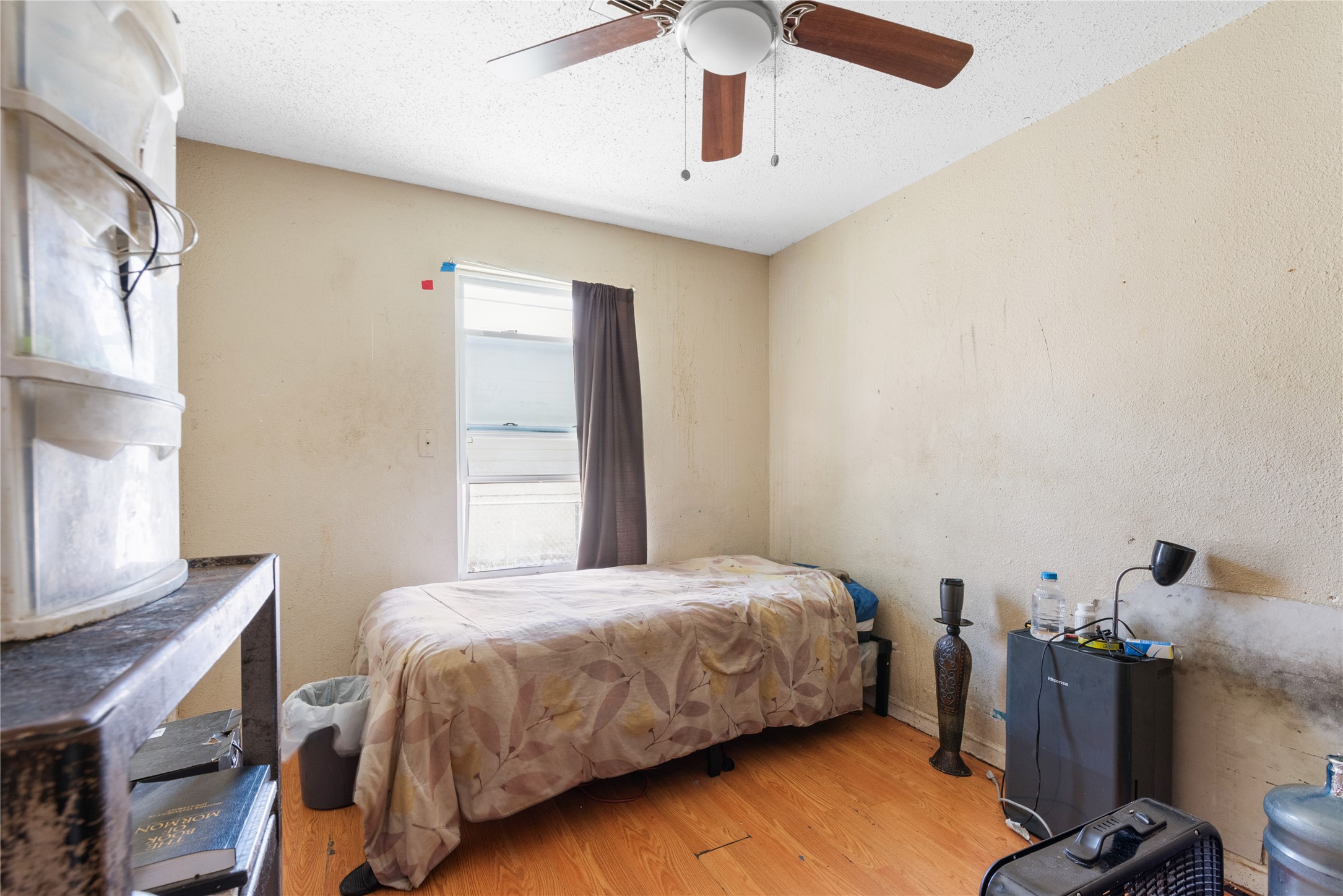 7105 Bethune Avenue Austin, TX 78752 - Photo 6 of 13 Bedroom featuring wood finished floors and ceiling fan