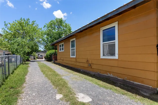 a house view with a backyard space