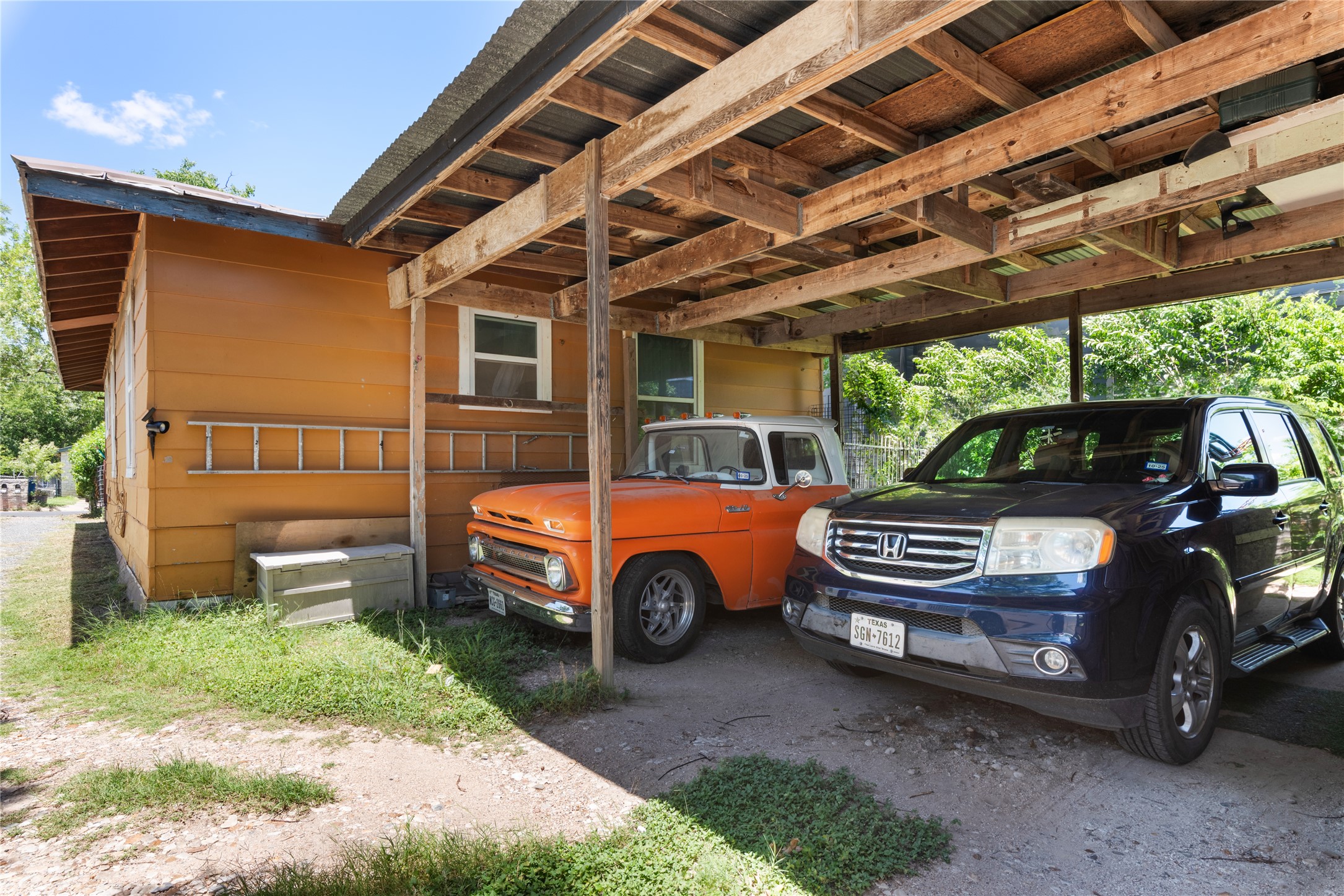7105 Bethune Avenue Austin, TX 78752 - Photo 9 of 13 View of home's exterior featuring a carport