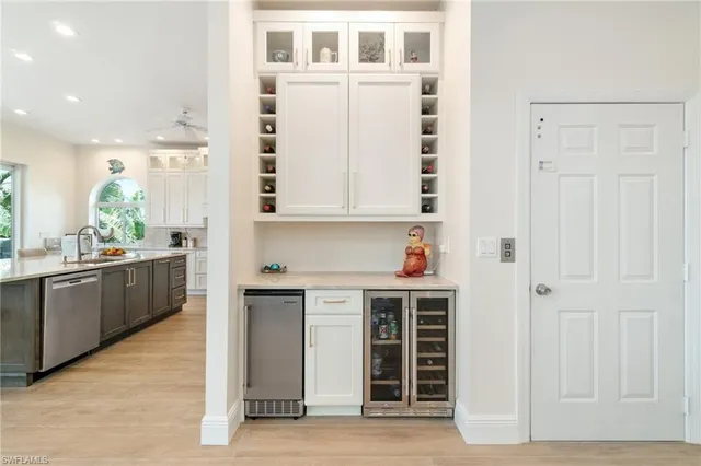 a dining room with furniture a flat screen tv and a floor to ceiling window