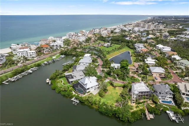 an aerial view of a houses with a lake view