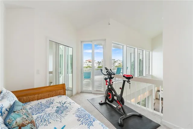 a bedroom with a bed and cabinets