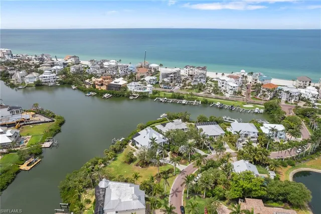 an aerial view of a house with a yard and garden