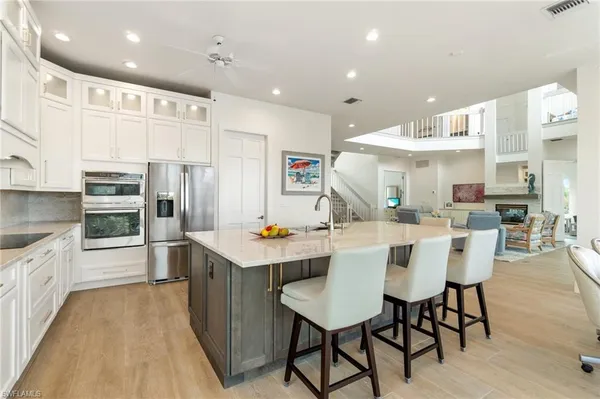 a kitchen with stainless steel appliances granite countertop a stove and a sink