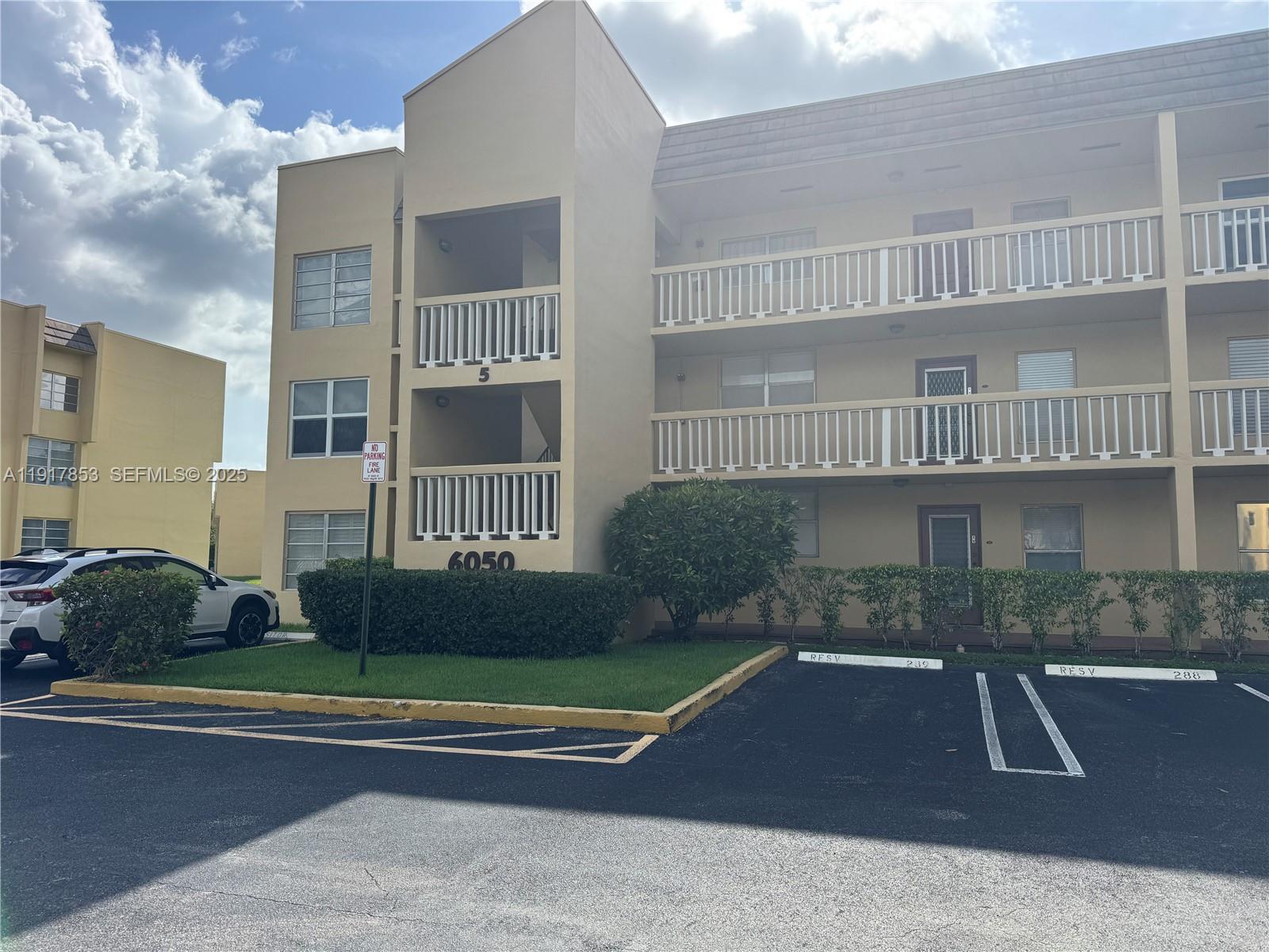 6050 Northwest 64th Avenue, Unit 306 Tamarac, FL 33319 - Photo 1 of 31 a view of a patio with a yard