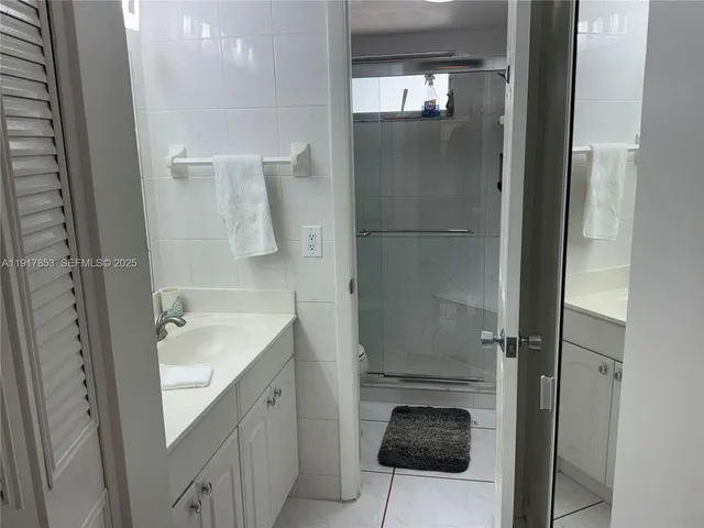 a bedroom with a bed and a table