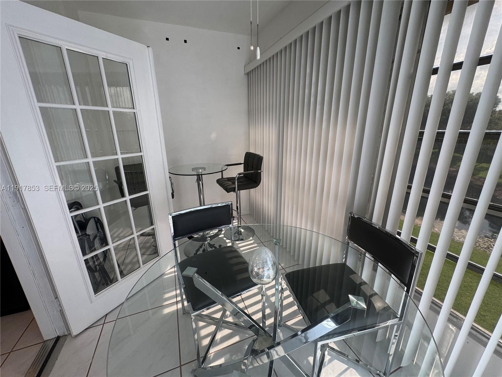 6050 Northwest 64th Avenue, Unit 306 Tamarac, FL 33319 - Photo 25 of 31 a view of balcony and chair