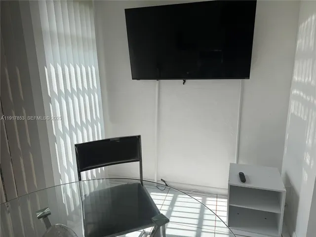 a living room with furniture and window