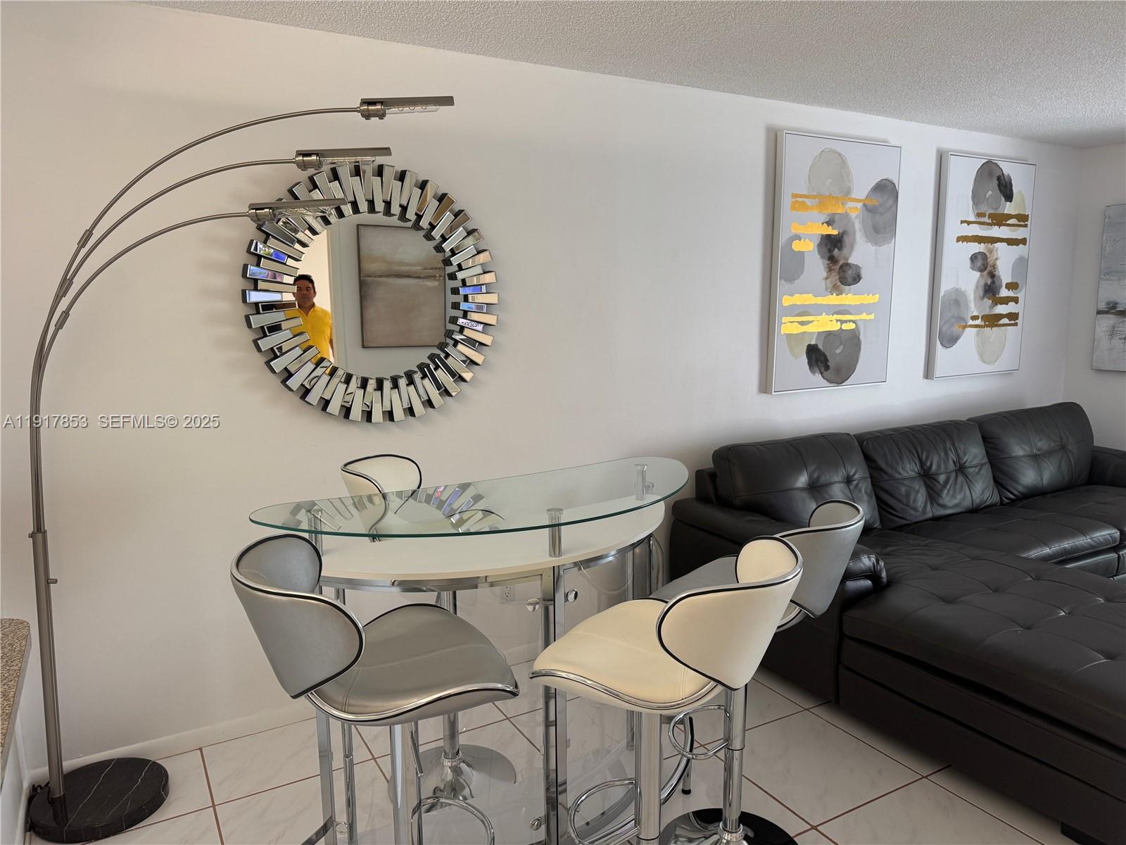 6050 Northwest 64th Avenue, Unit 306 Tamarac, FL 33319 - Photo 27 of 31 a living room with furniture and window