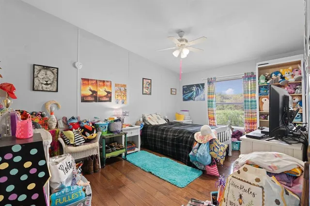 a living room with lots of furniture and a flat screen tv