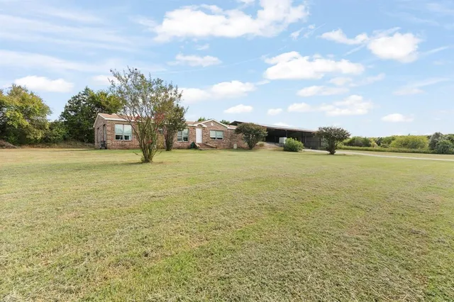 a view of a lake with houses in the back