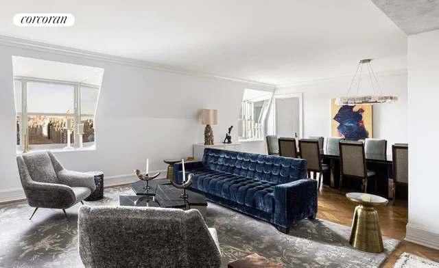 a living room with furniture a bed and a window