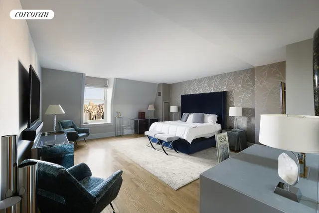 a bed room with furniture and a flat screen tv