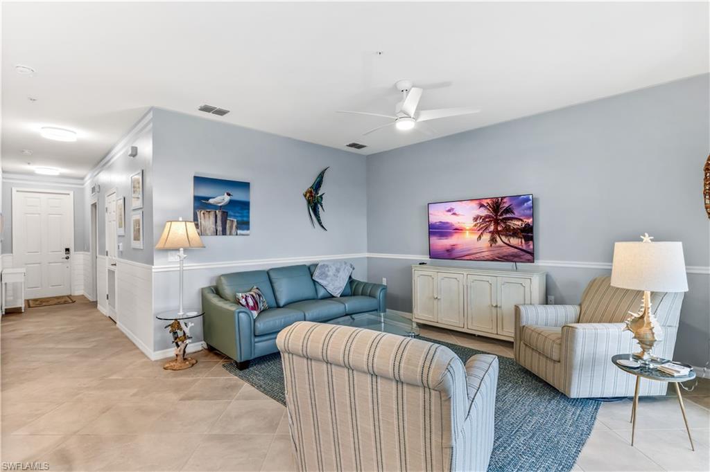 43989 Boardwalk Loop, Unit 2042 Babcock Ranch, FL 33982 - Photo 12 of 12 a living room with furniture and a flat screen tv