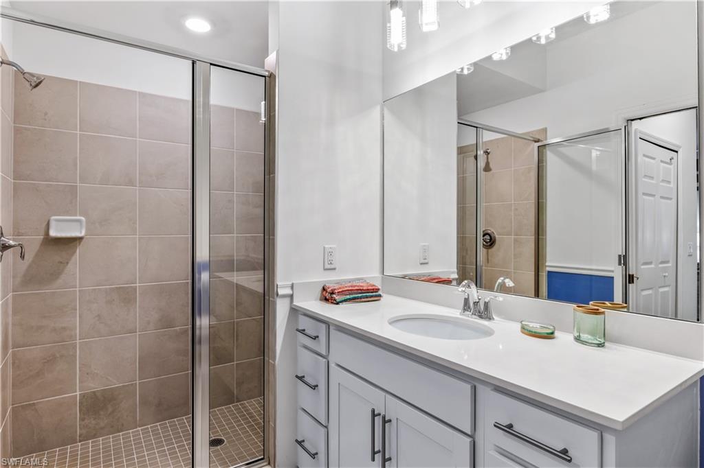 43989 Boardwalk Loop, Unit 2042 Babcock Ranch, FL 33982 - Photo 2 of 12 a bathroom with a sink double vanity and a shower