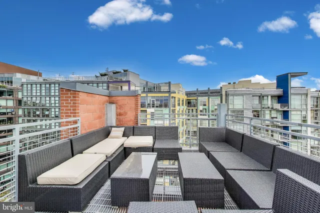 a view of a balcony with furniture